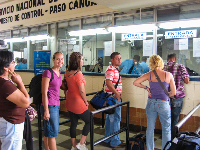 Alyssa waiting in line with a small backpack at the border crossing between Costa Rica and Panama
