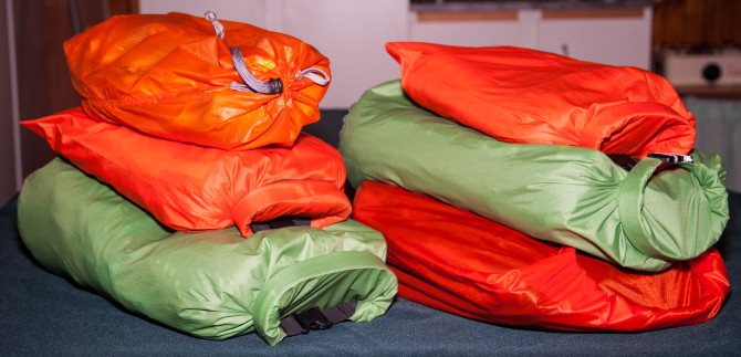 All clothes packed in two stacks of waterproof bags