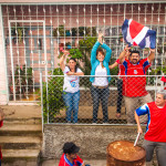 Costa Rican wins world cup 2014 and Waving Flags in their front yard