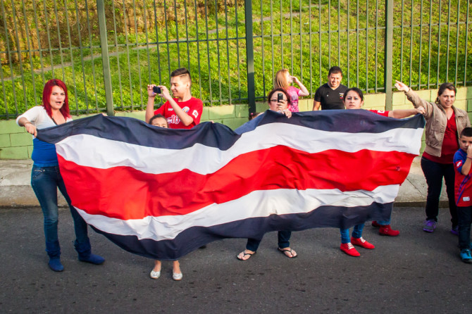 Costa Ricans Waving a huge Flag after winning the world cup against greece