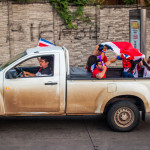 Costa Ricans celebrating winning world cup 2014 in back of pickup truck