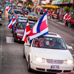 Costa Ricans celebrating winning world cup 2014 street full of cars and people