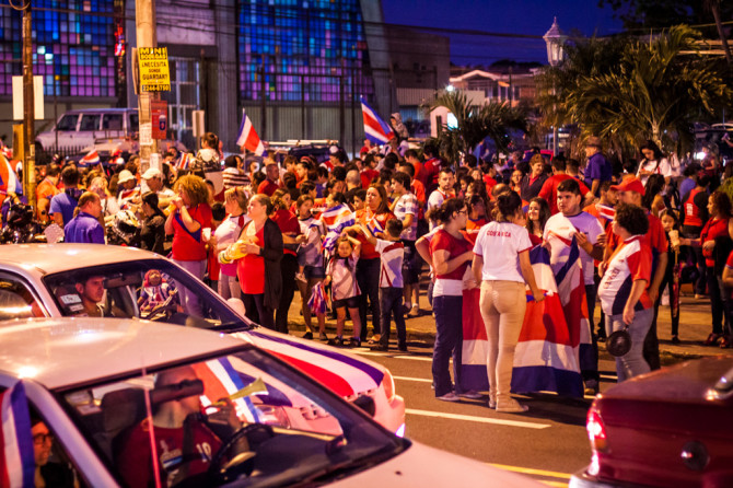Crowds of people in park celebrating Costa Rica winning world cup