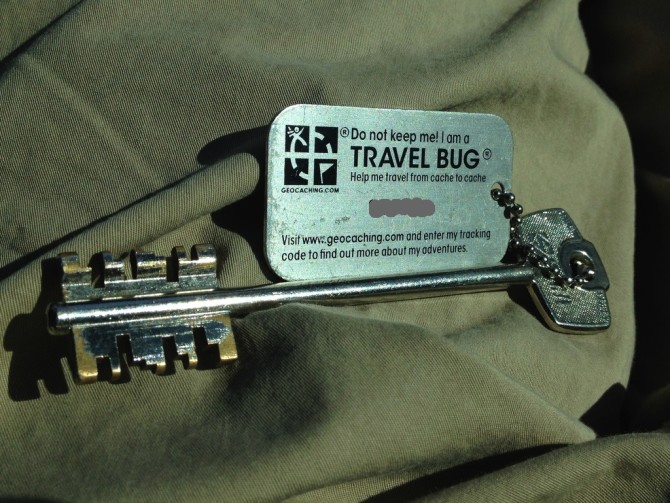 Travel Bug attached to an Old Style Key