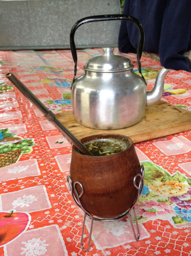 Yerba Mate in Gourd on Table with Hot Water Kettle