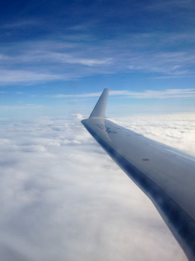 Airplane Flight Above Clouds to Renew your Visa in Costa Rica