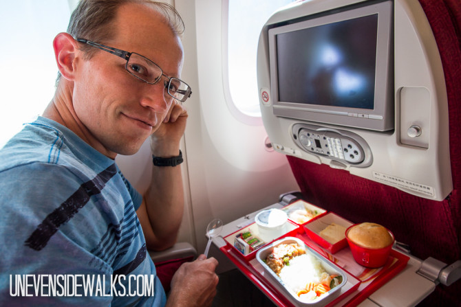 Landon in Airplane Seat with Meal on Hainan Airlines International Flight
