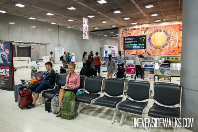 Waiting near Baggage Claim on Long International Flight Survival Tips Sleeping When You Can