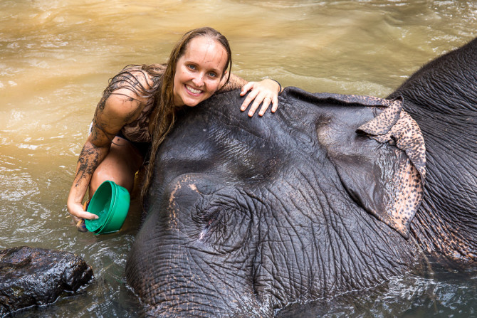 Alyssa Cuddling with an Elephant in Thailand